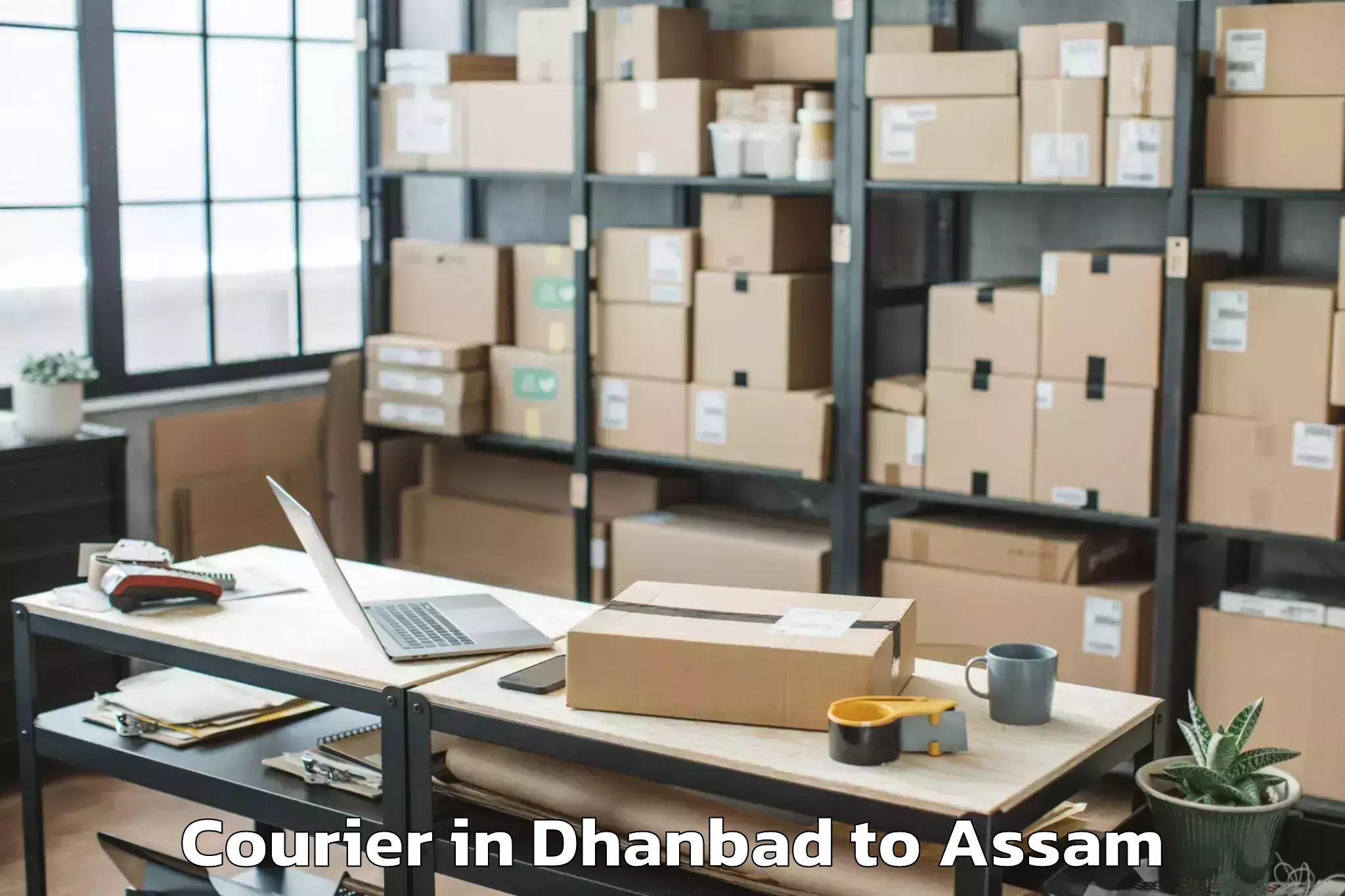 Top Dhanbad to Raha Gaon Courier Available